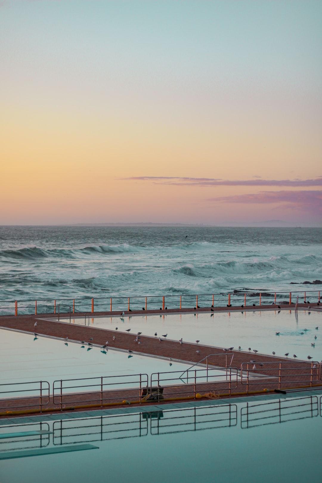 A poolside view of the sea.