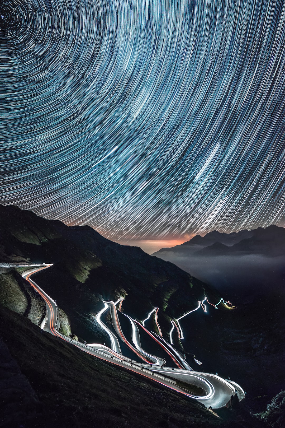 One night adventure in the beautiful Passo dello Stelvio in north of Italy, over 30 road bends, 18 shots of 30 seconds for the car lights on the road and 1 hour timelapse for the startrail.