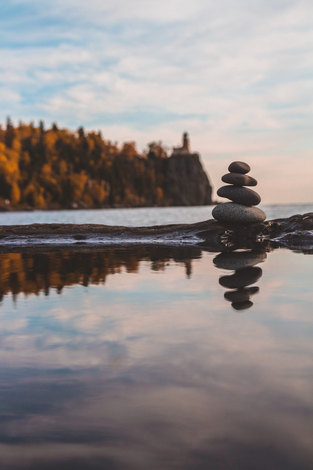 Stack of rocks reflected in a tide pool at Split Rock Lighthouse in Minnesota