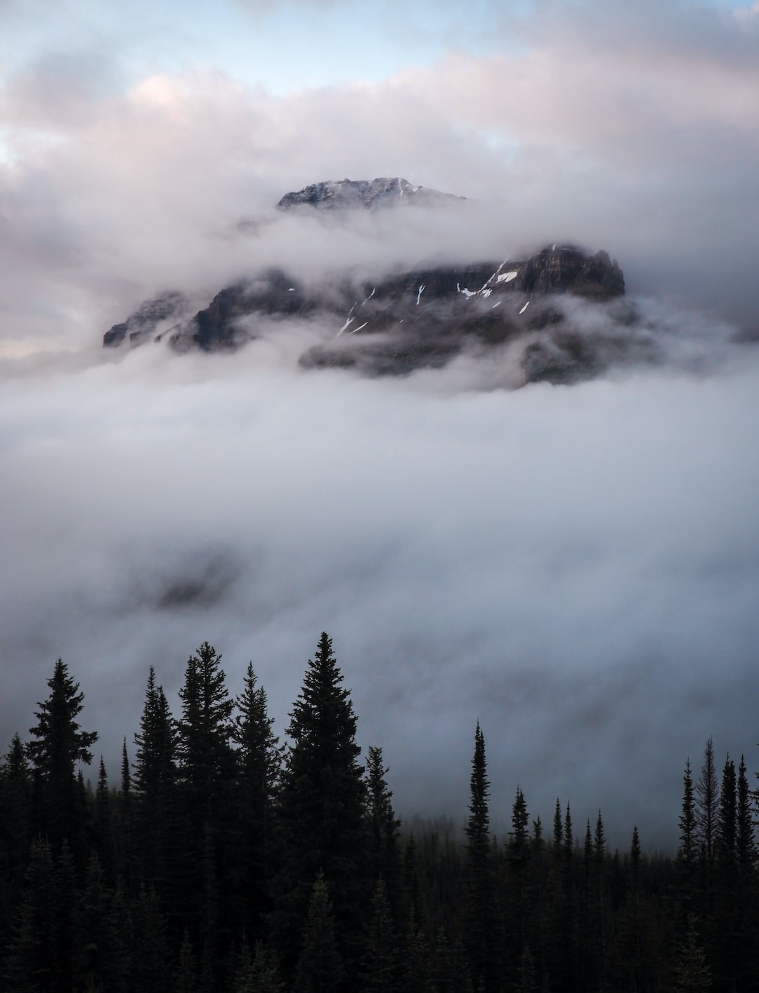 Remnant clouds from the previous night's storm in Banff, Alberta, Canada.
