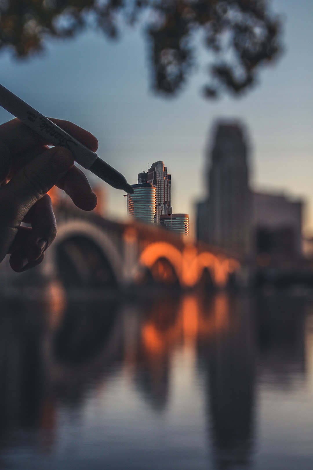 Holding a sharpie coloring in the buildings of downtown Minneapolis