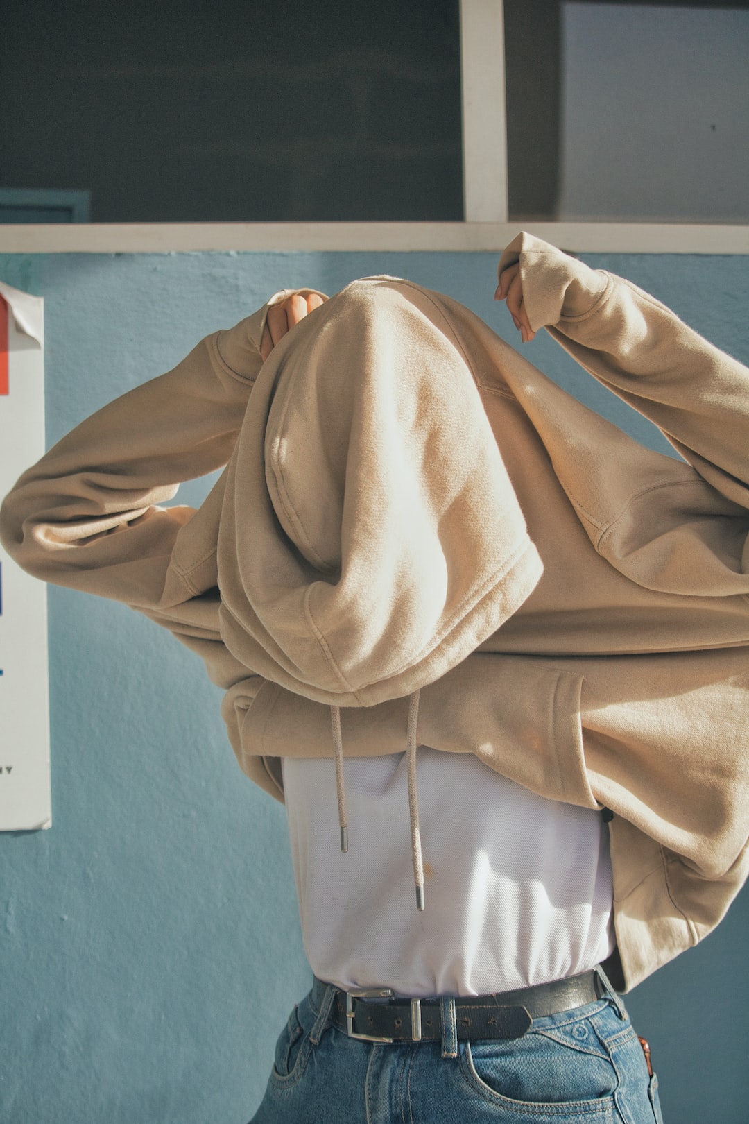 Girl with a beige hoodie