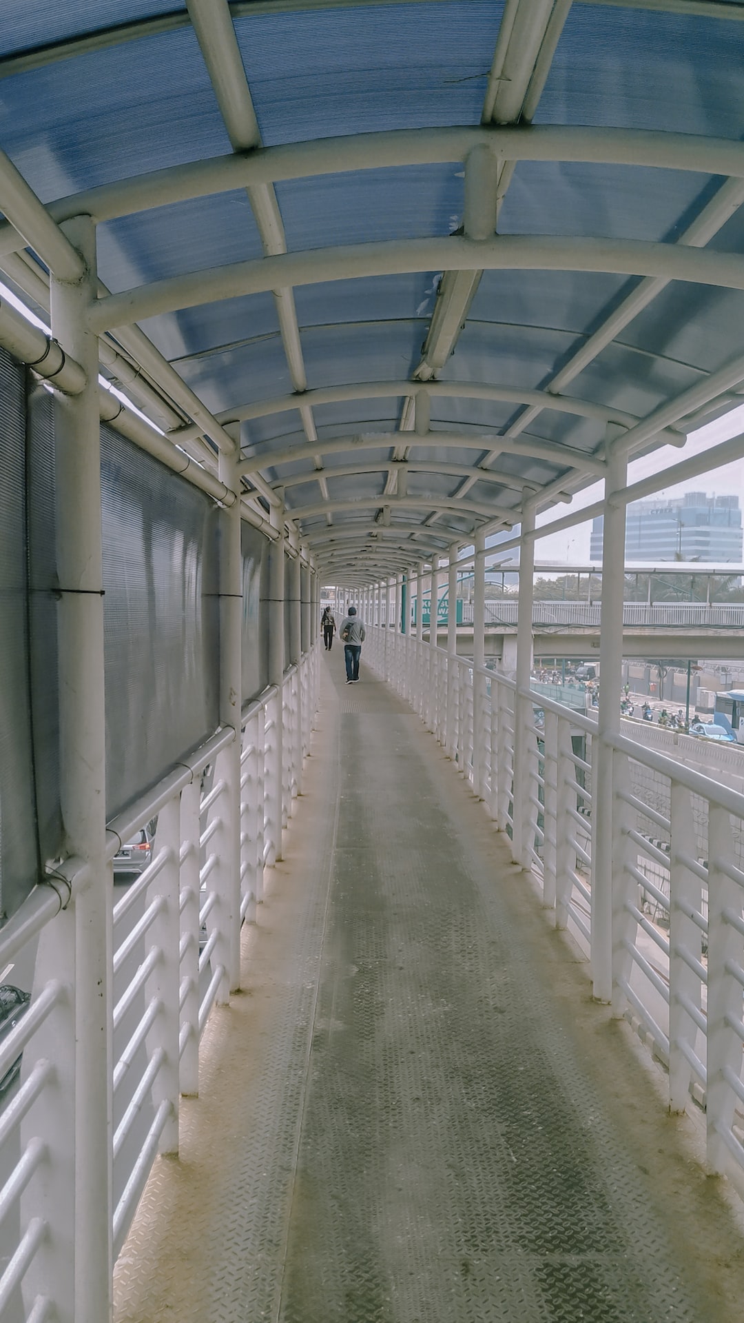 Walking on the bridge to go to busway station