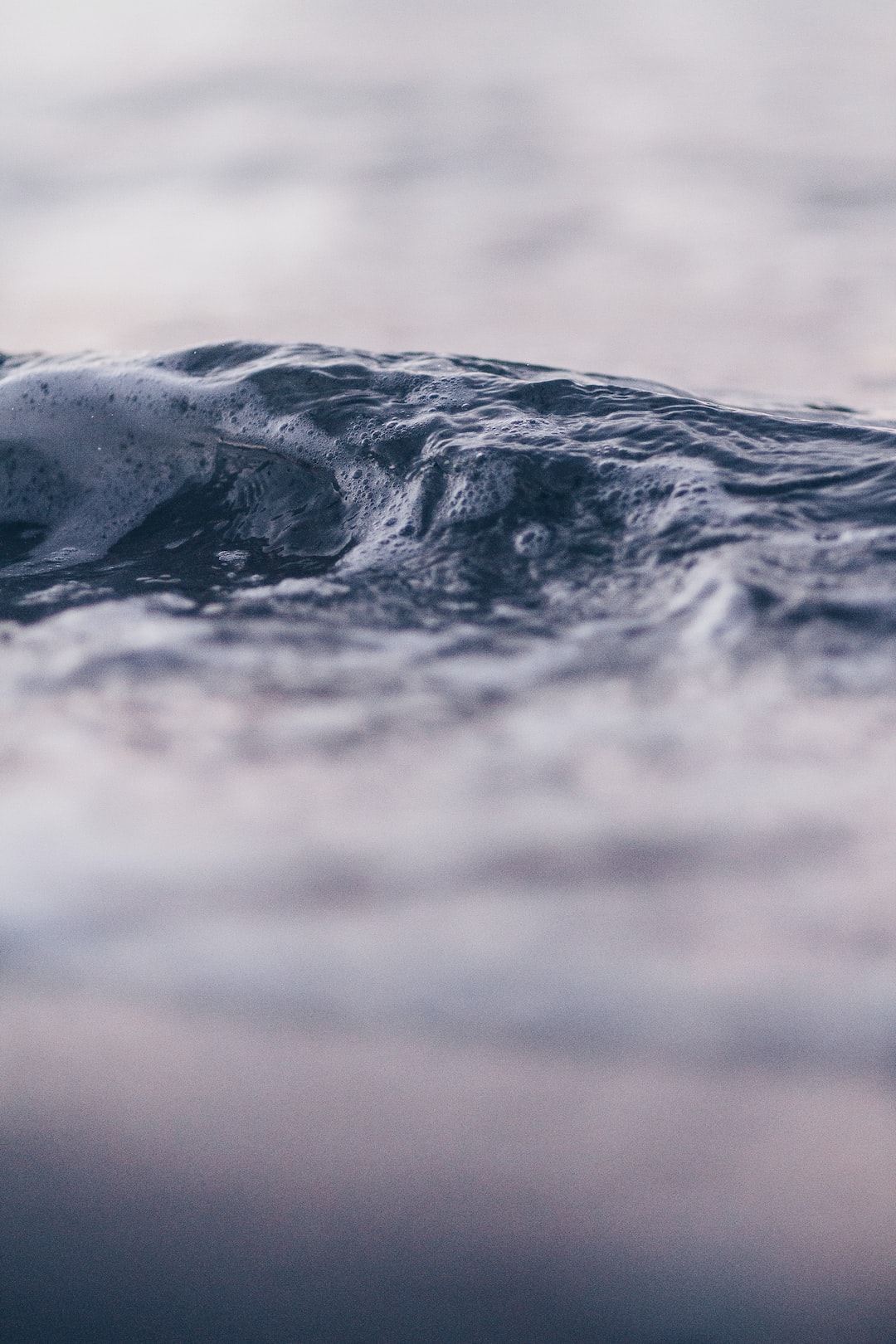 Wave forming as the sun sets - Kohimarama, New Zealand