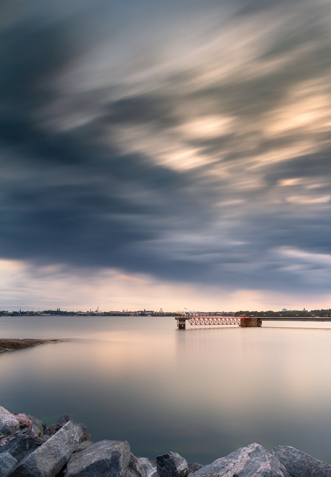 A view from the old oil harbour on the island of Laajasalo in Helsinki. Helsinki City in the background. This long exposure shot was taken before some heavy rain poured down.