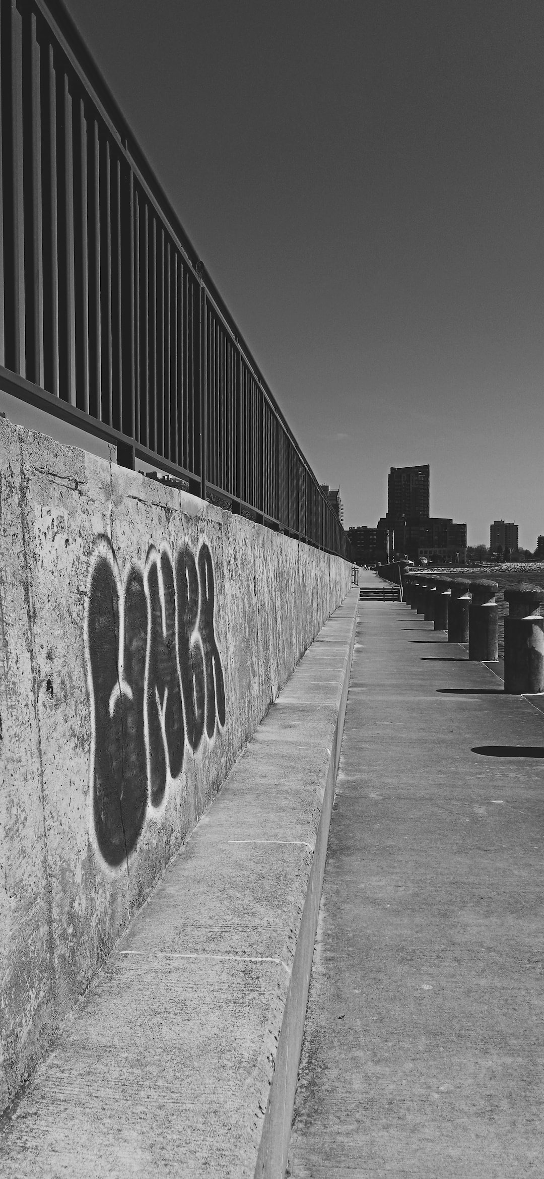 graffiti tag on concrete wall downtown by lake