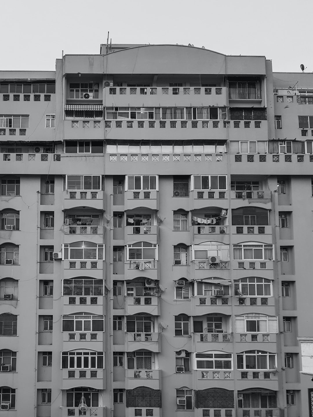 A black and white shot of buildings - apartments.