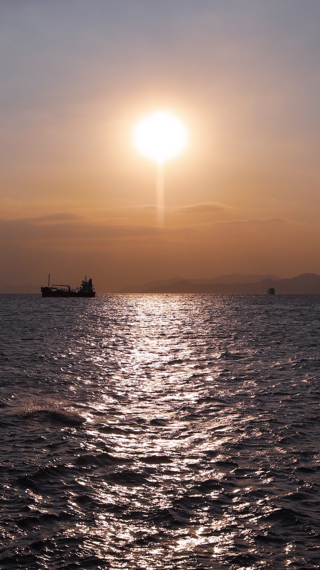 Evening sun glistening on the sea at Sai Wan Swimming Shed, Hong Kong