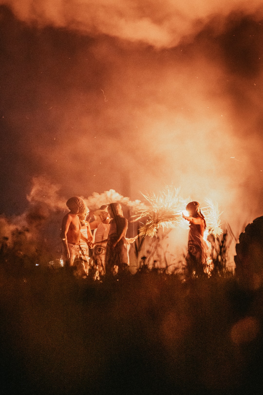 Lighting a fire sculpture at ILANDSOUND festival in Saaremaa, Orissaare.