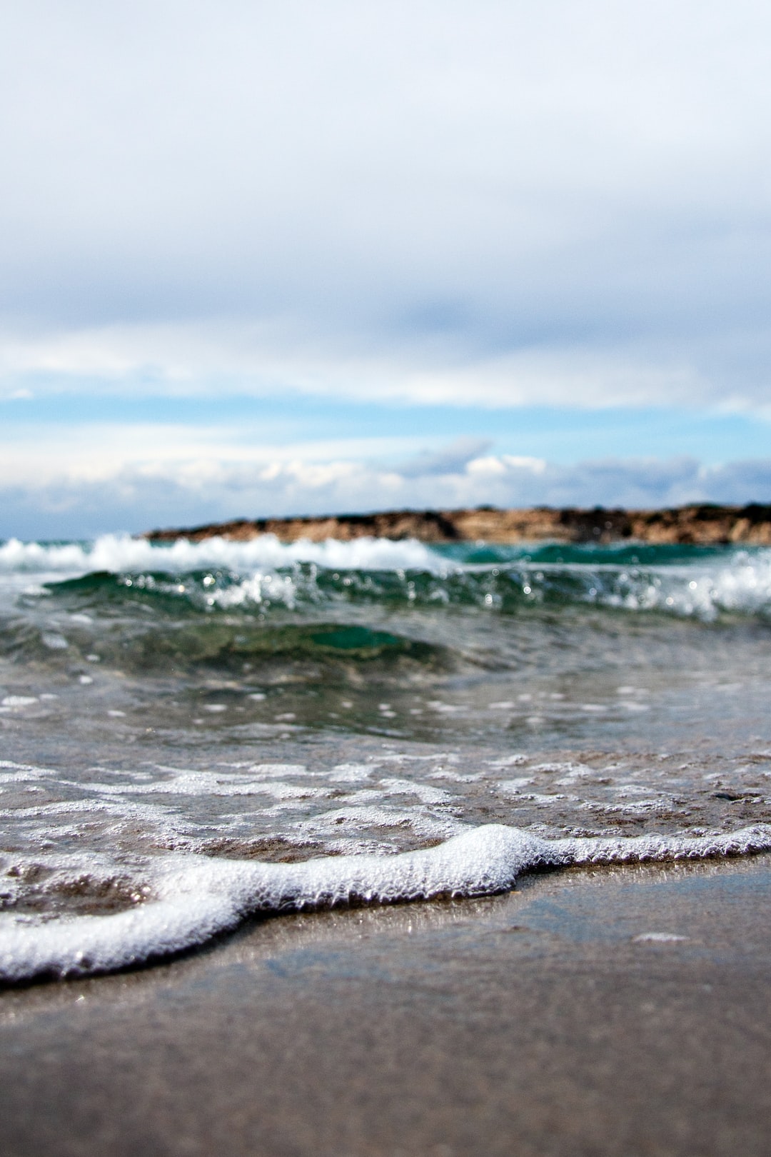 Ocean wave race to beach shore