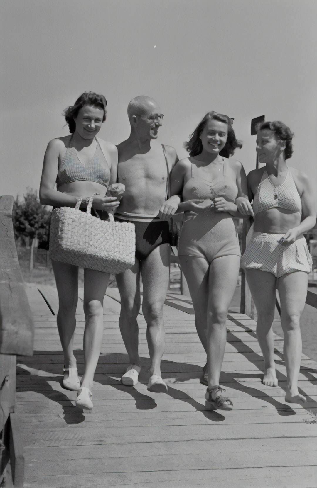 Friends walking to bathe at the beach, 1940