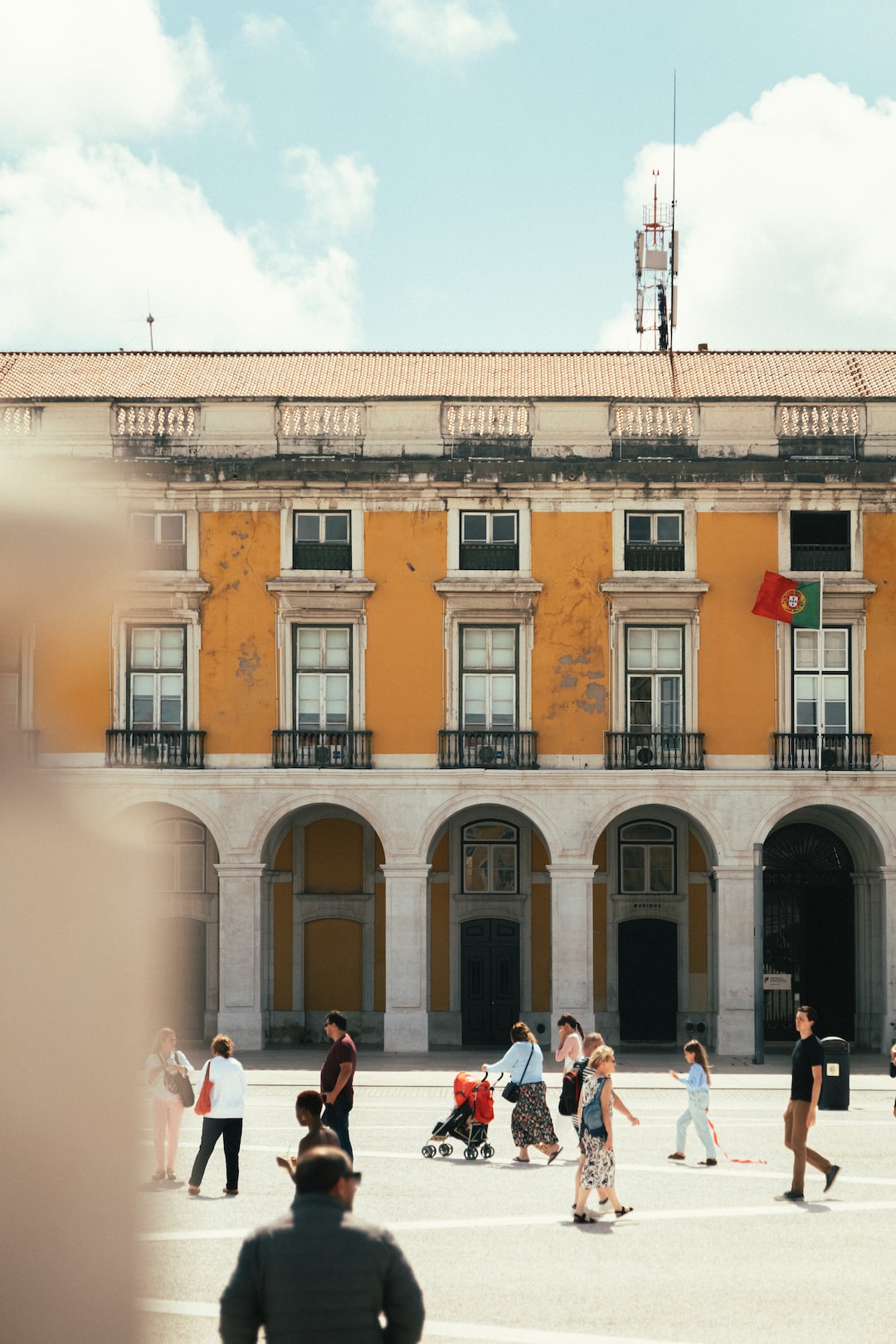 People wander around the city center in Lisbon, Portugal