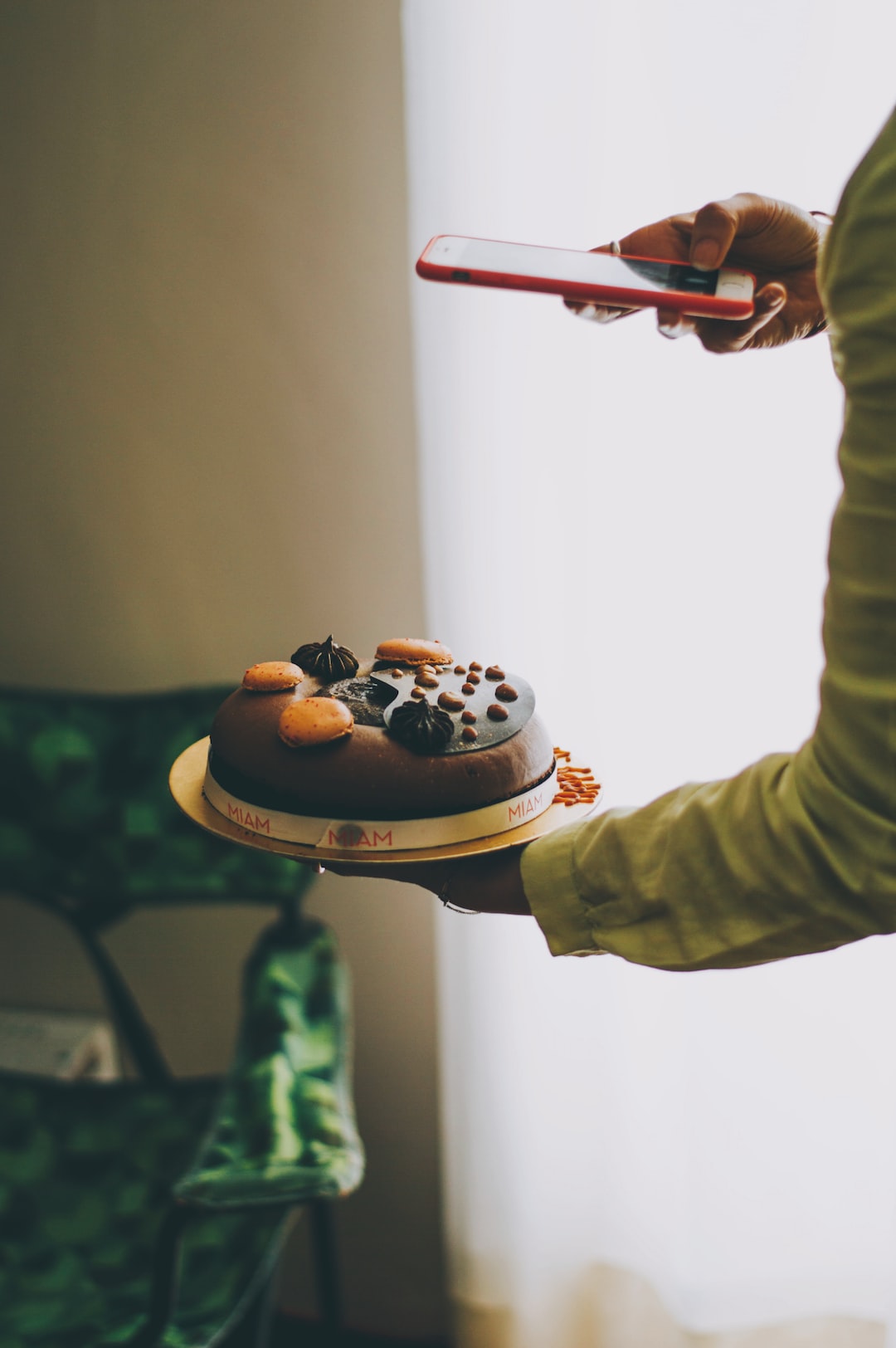 Birthday cake being photographed to be posted on instagram.