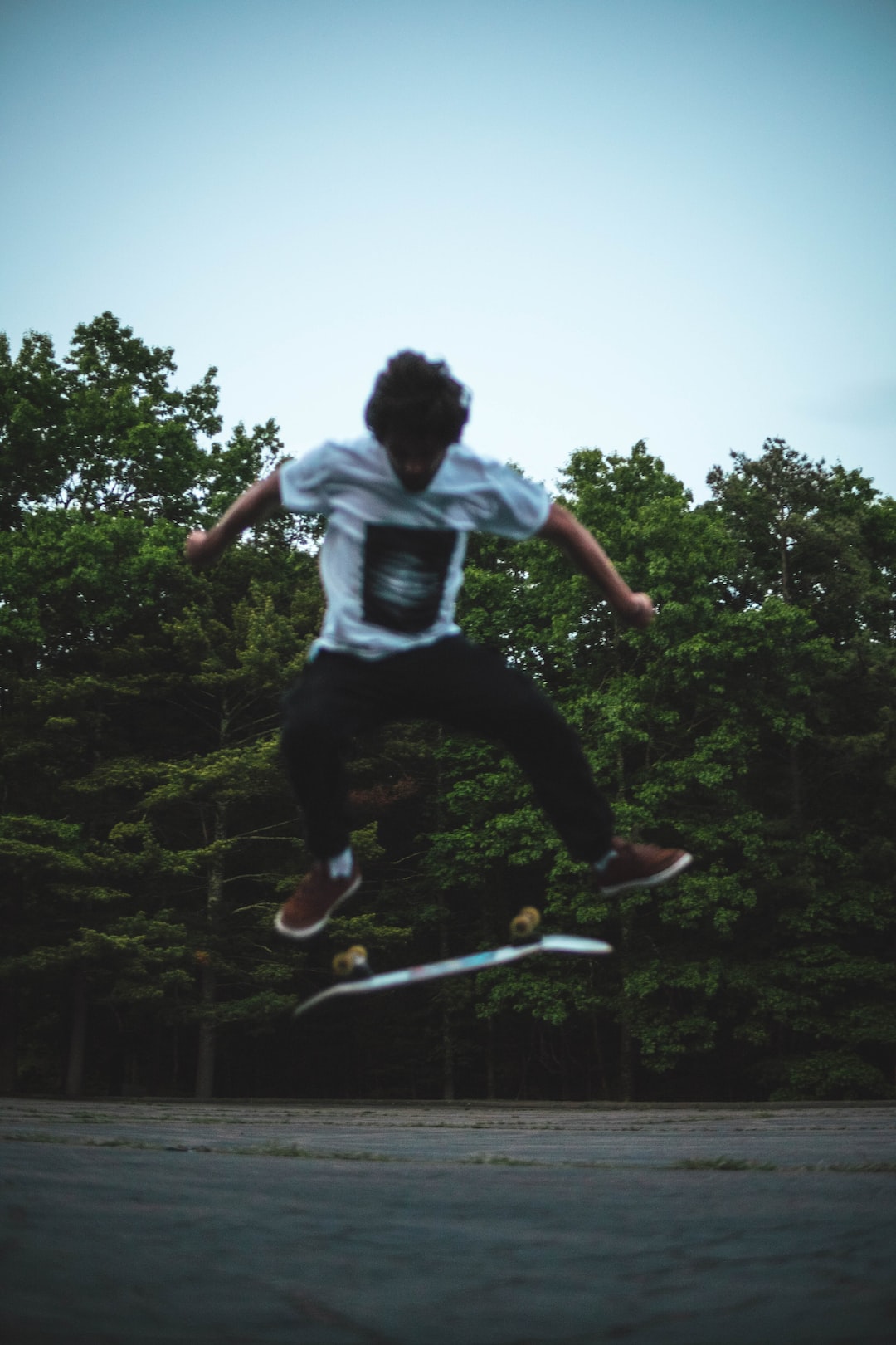 Skating on a warm summer day at sunset in the woods