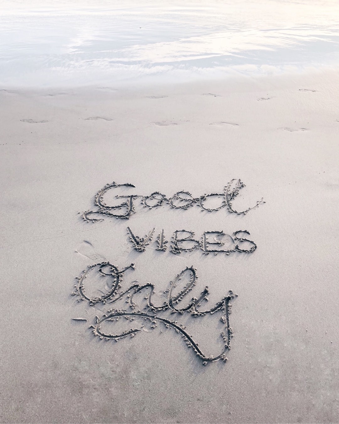 I have always loved calligraphy and if I see a spot to add some letters somewhere, I’ll usually do it. :) This was at Venice Beach, and the sand was so smooth, I had to add some words.