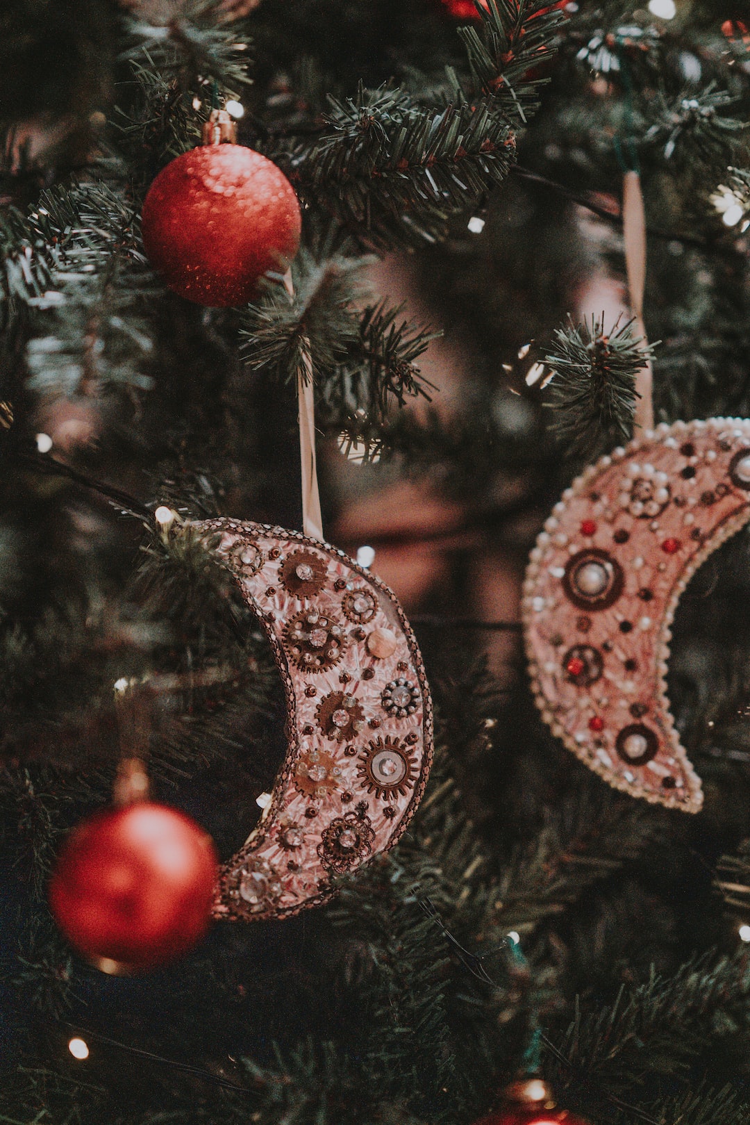 Moon decorations hanging on a christmas tree