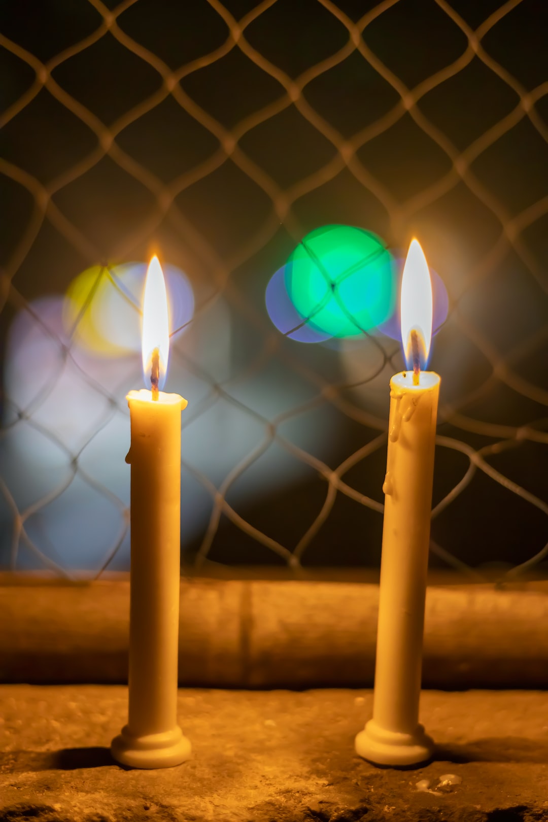 Two candles are sitting like a couple. both are lighten .A romantic night. A beautiful background with candles