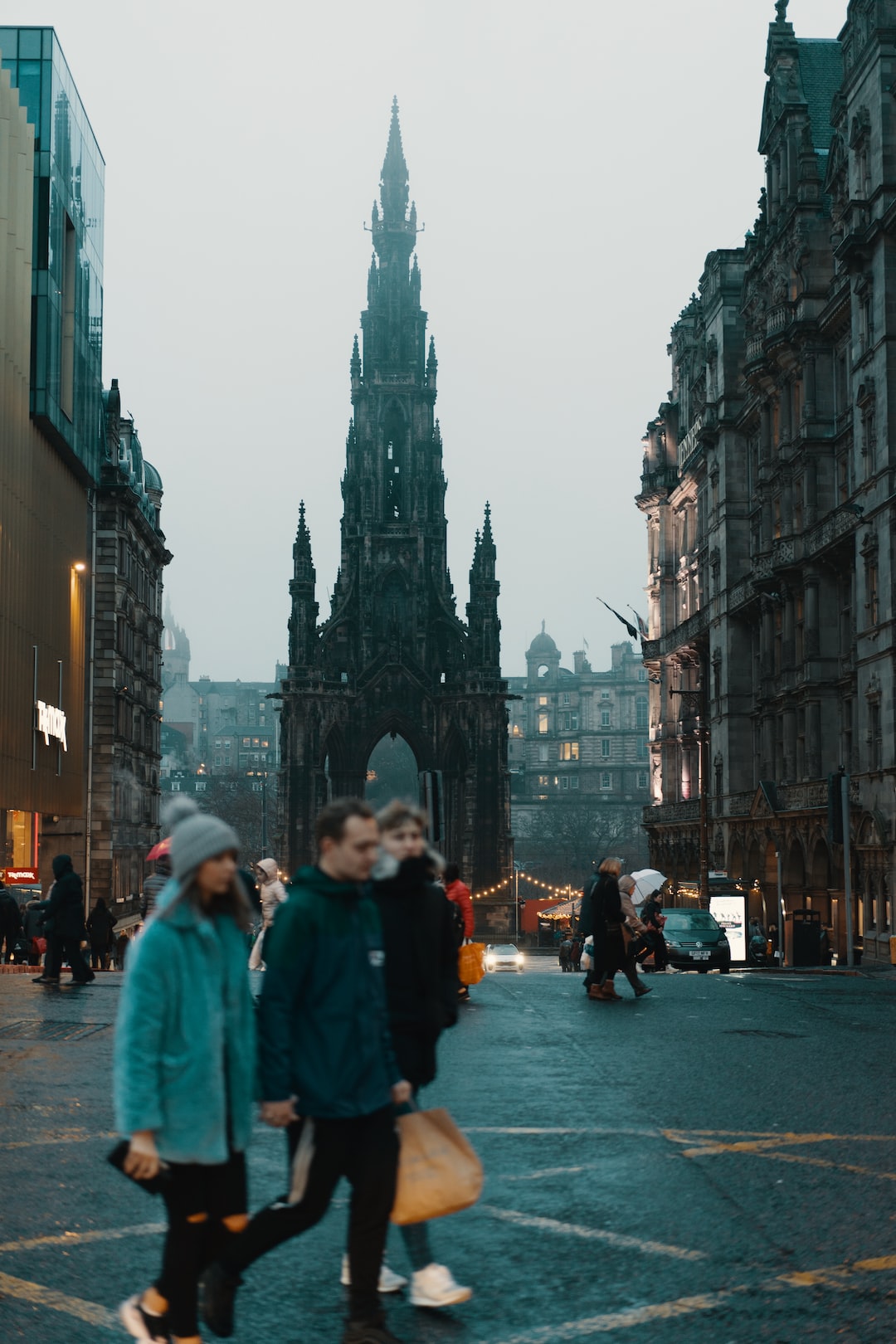 People shop in Edinburgh, on a cold, foggy Saturday