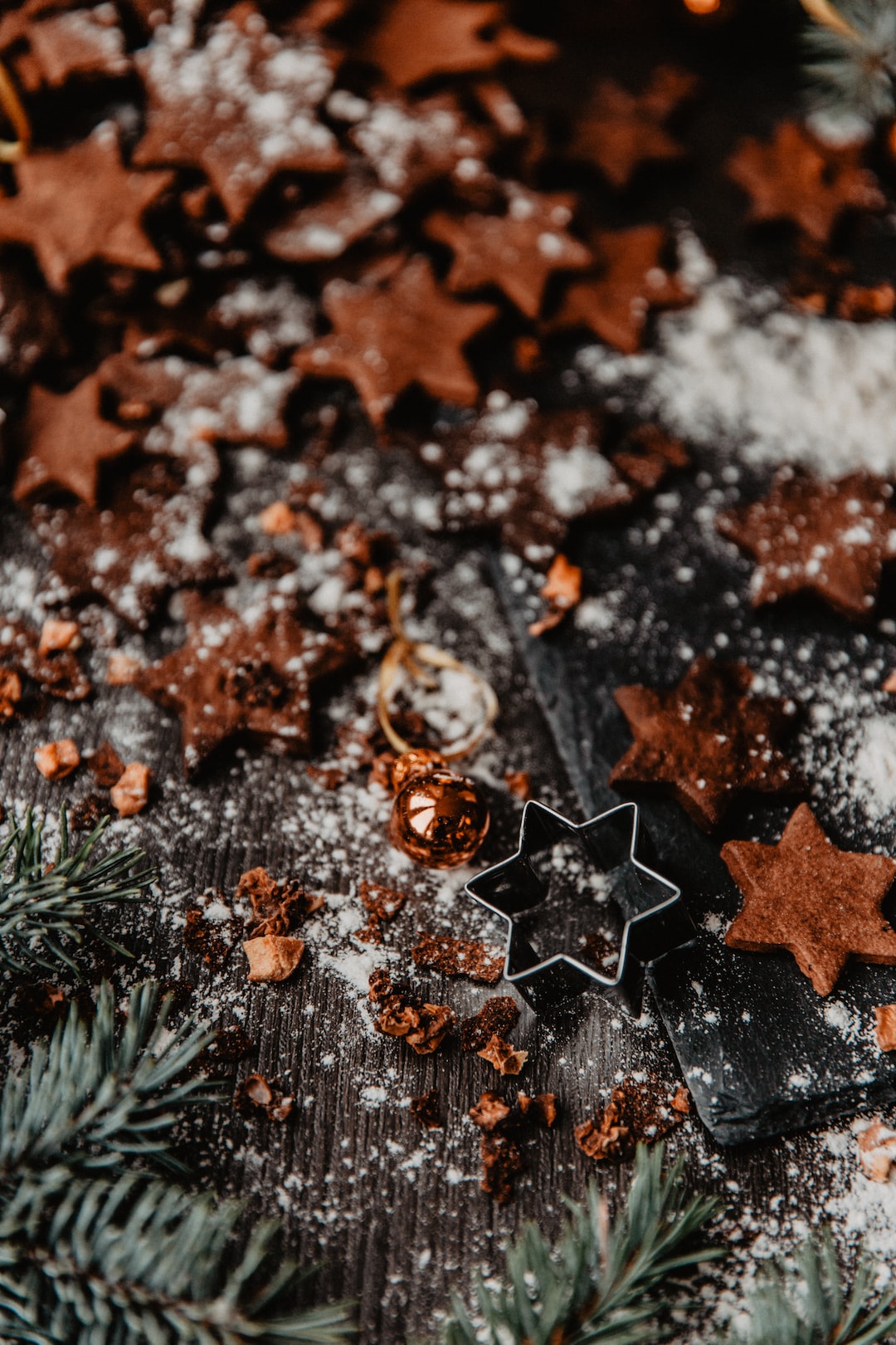 Gingerbread cookies on wooden table with Christmas ornaments