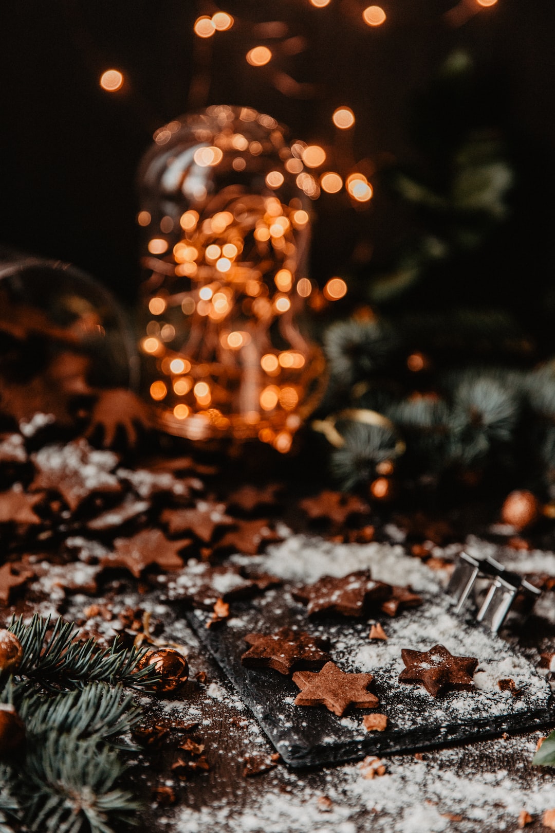 Gingerbread cookies on wooden table with Christmas ornaments