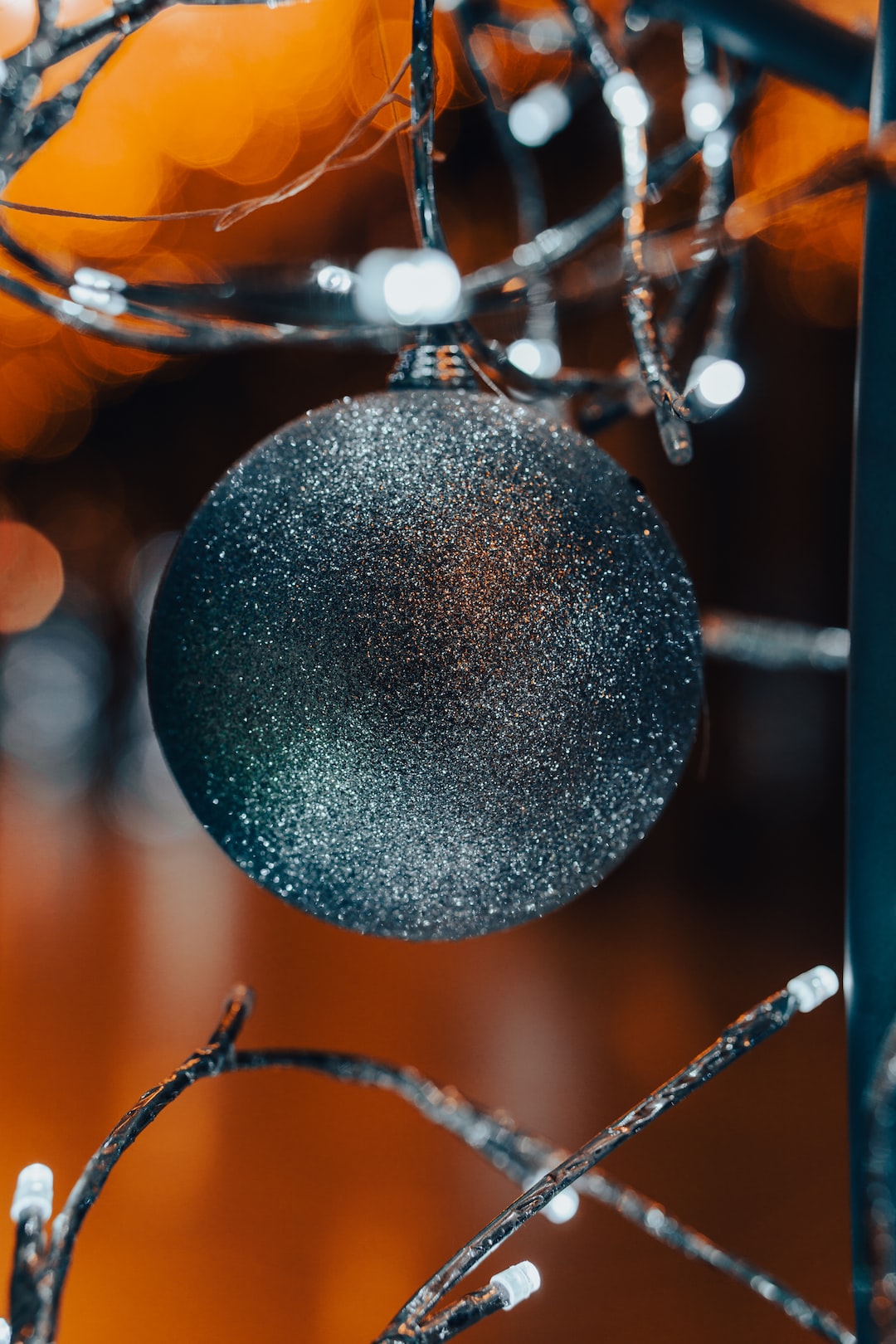 Close up of a silver, glittery bauble