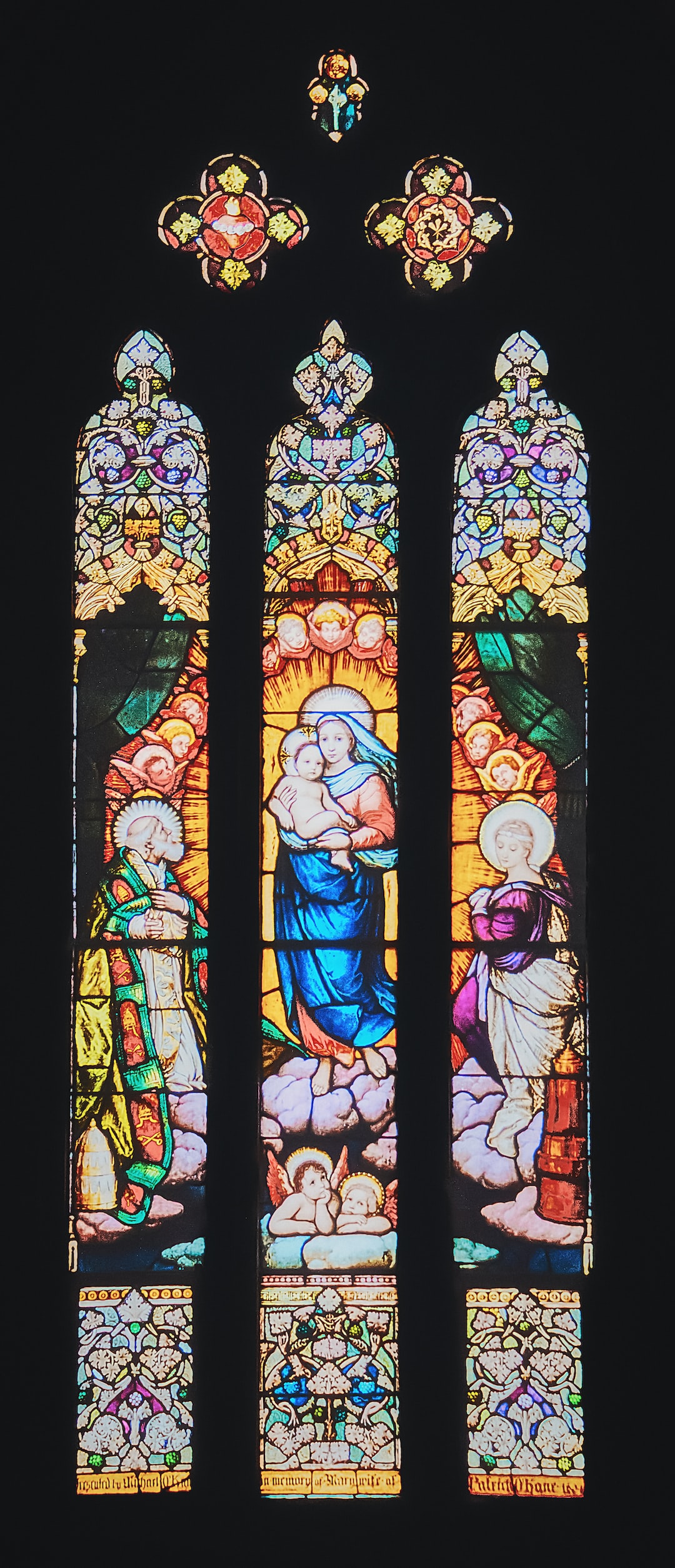 A stained-glass window depicting the Madonna and Child (a.k.a.Mary and Jesus) in St. Eugene's Cathedral in Derry (Nov., 2019).