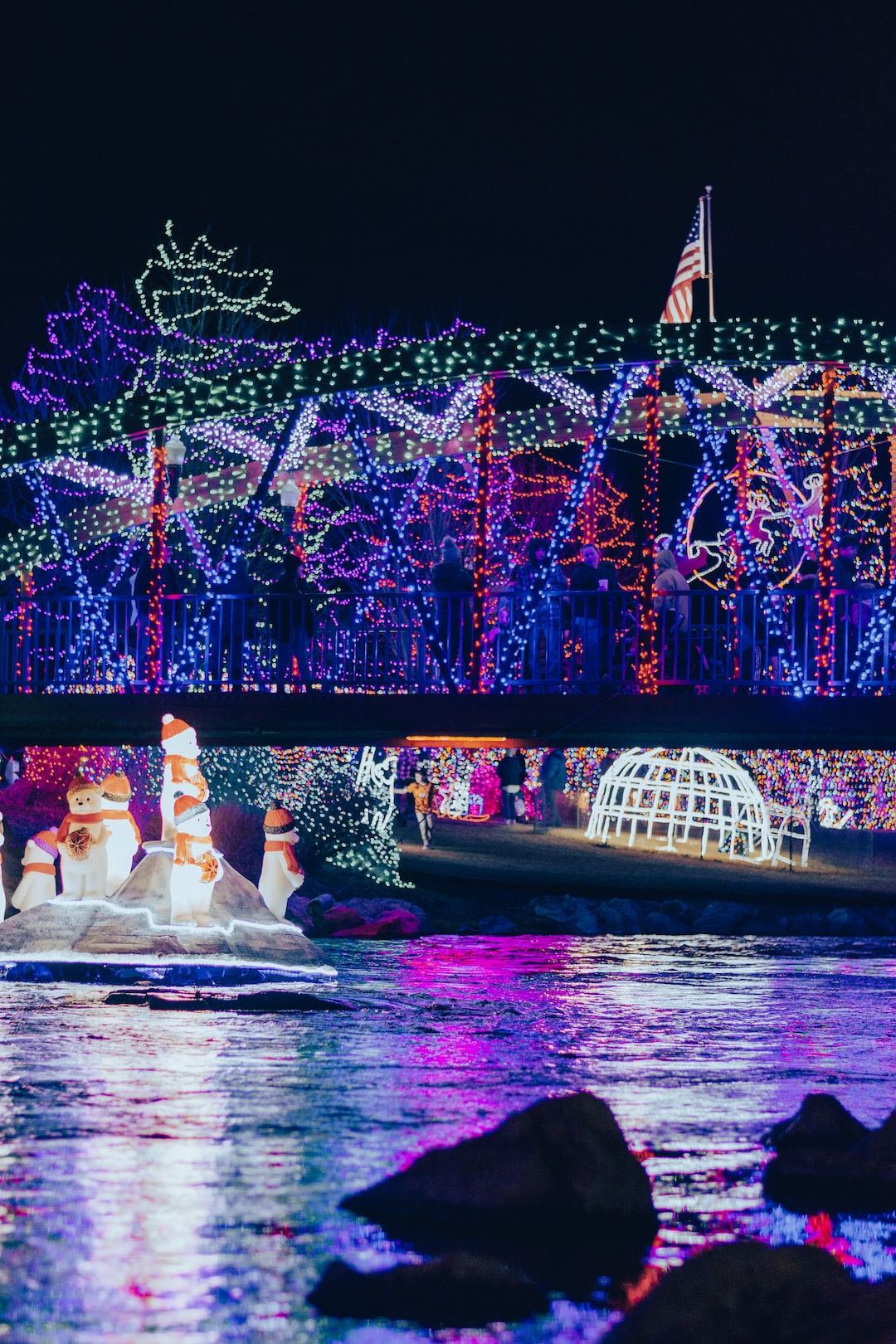 Bridge decorated in colorful christmas lights.