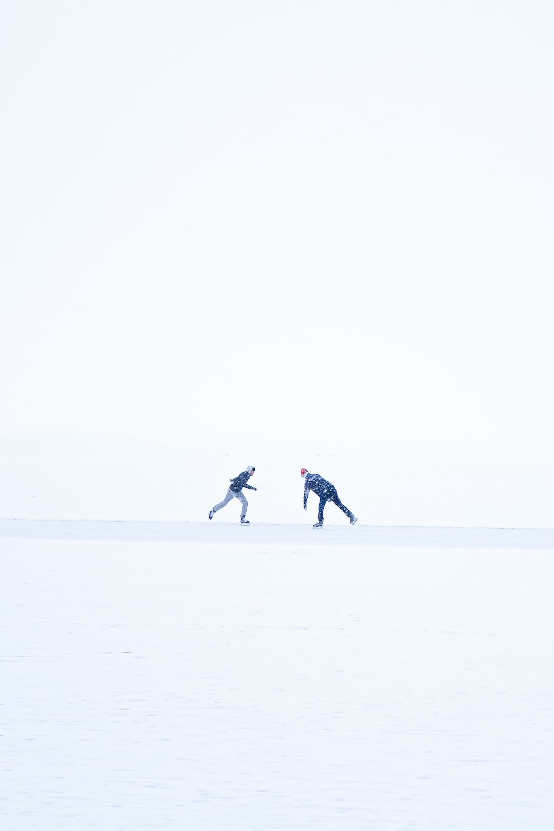 Two men figure skating on a frozen lake. - - - Hey, if you like my photos and want to see more, visit my webpage myrtorp.com - Paypal Support: paypal.me/pmyrtorp - follow me on Instagram: @myrstump - Contact me at Philip@myrtorp.net