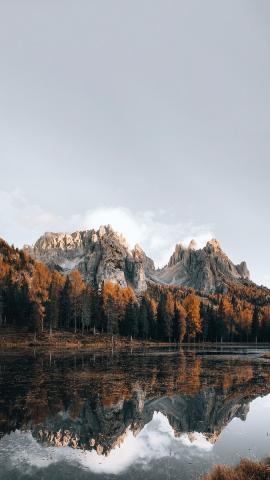 Download premium image of Dolomites lake in autumn mobile phone wallpaper by Luke Stackpoole about autumn iphone wallpaper, iphone wallpaper, rock mountain, nature wallpaper, and autumn mobile wallpaper 2094657