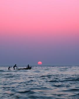 Three men in a boat