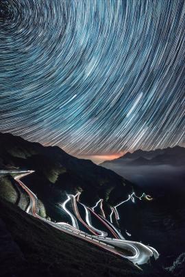 One night adventure in the beautiful Passo dello Stelvio in north of Italy, over 30 road bends, 18 shots of 30 seconds for the car lights on the road and 1 hour timelapse for the startrail.