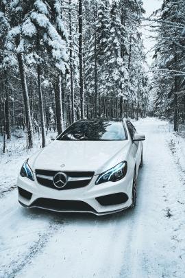 Mercedes-Benz E400 Coupe AMG in the woods during Canadian winter