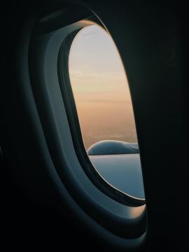 airplane window sunset sky