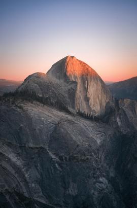 Half Dome in Yosemite taken from the edge of Mount Watkins — stunning sunset and great alpenglow.