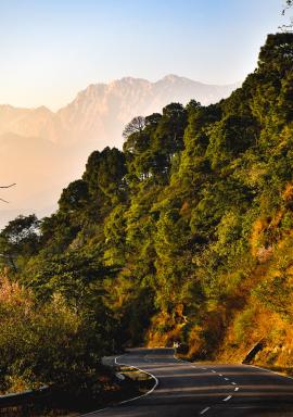 A hilly road during sunset