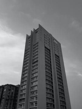 A black and white shot of buildings - apartments.