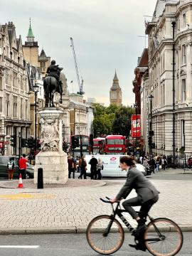 Cyclist at the Trafalgar Square, London street with the Big Ben
