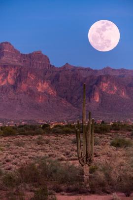 End of the golden hour and start of the Lunar hour as the Full moon rises over the Superstitions overlooking Apache Junction