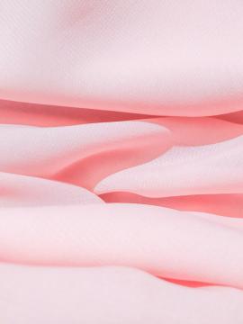 Pink fabric folded.