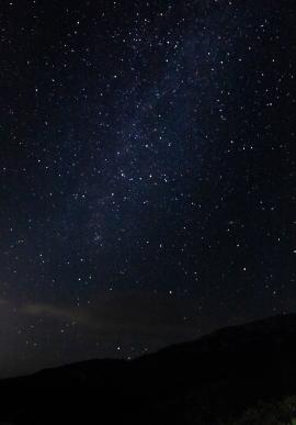 Long exposure shot of the starry sky on a summer night near Ohrid Lake