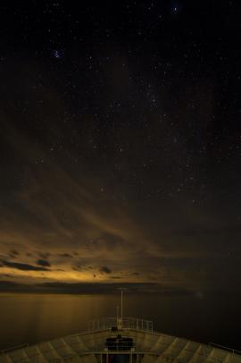 This was taken on a moving ship with a 6 year old entry level mirror-less camera mounted to a 5$ tabletop tripod. Sometimes the seemingly impossible situations yield to stunning opportunities.