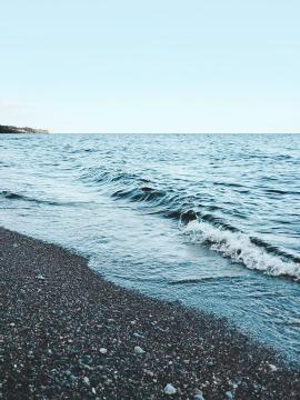 blue waves with rocks in Lake Ontario
