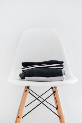 White chair with clothes