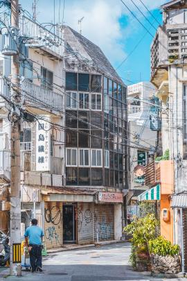 A delivery man on a street in Naha, Okinawa, Japan.