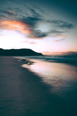 Early morning moody sunrise on the beach.