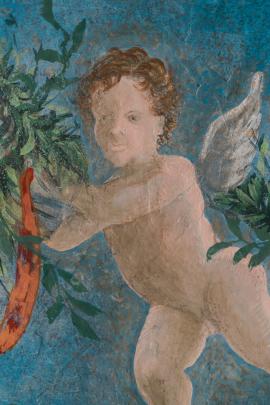 Fresco of a cherub on a wall in Rome, Italy