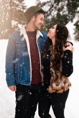 Couple holding each other in the snow
