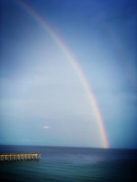 Rainbow into the ocean
