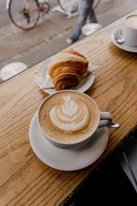 Cappuccino and croissant in the Original Coffee – Copenhagen Denmark