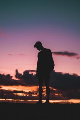 Silhouette of a man stood on the wall 